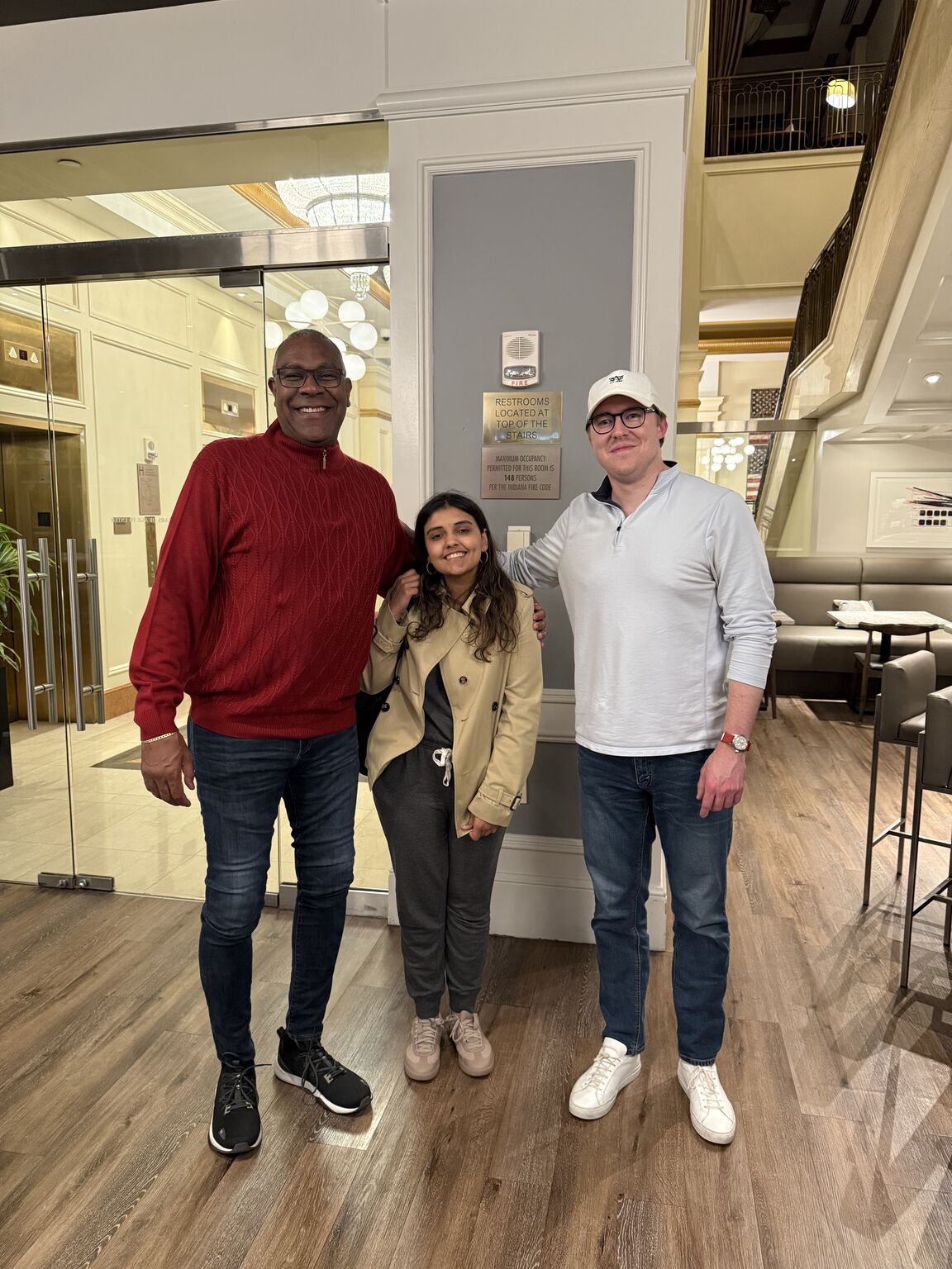 The three-person Indianapolis photograph shared with the announcement of Christopher Whitfield joining the advisory board.