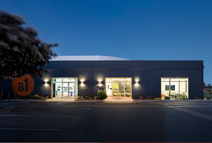 The illuminated MBC BioLabs building at dusk, from our February 2025 arrival post.